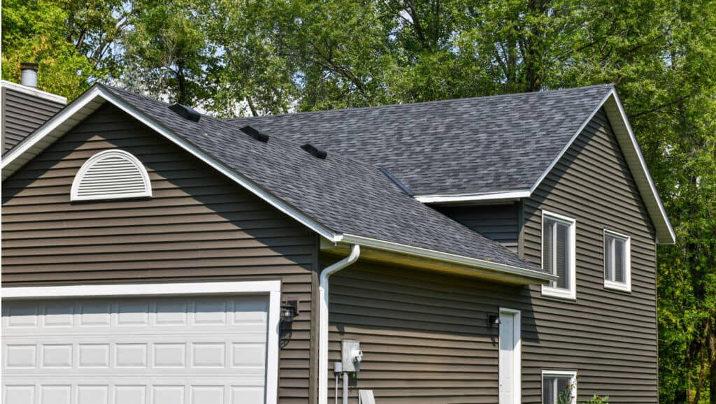 Modern house with gray roof and garage