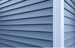 Close-up of gray vinyl house siding