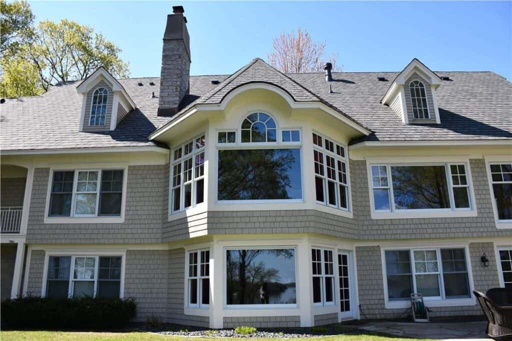 Large house with multiple windows and chimney.