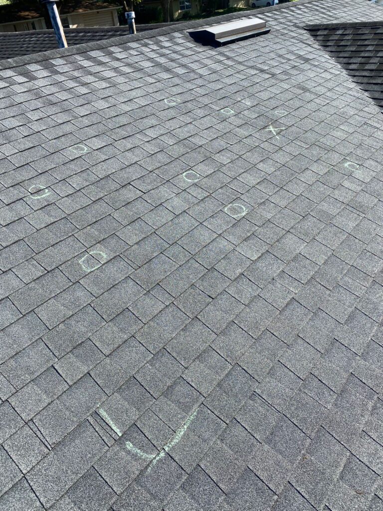 Roof with shingles and chalk markings