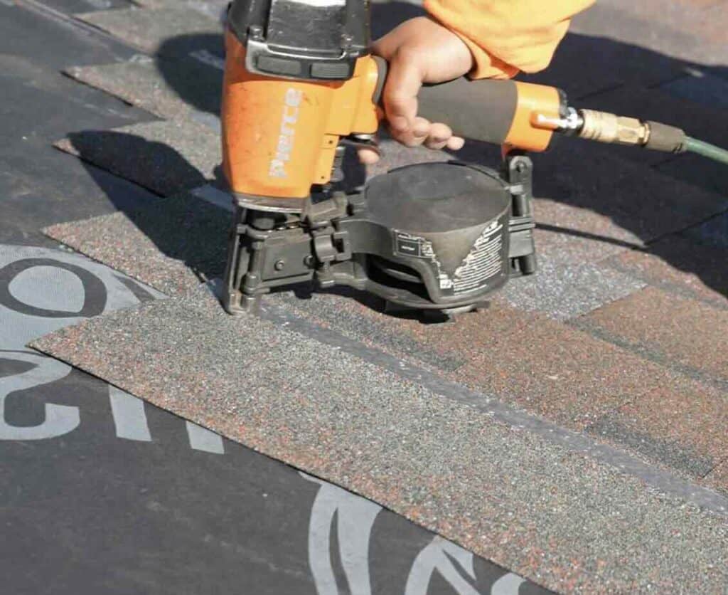 Installing roof shingles with pneumatic nail gun