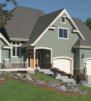 Modern green house with a landscaped yard.