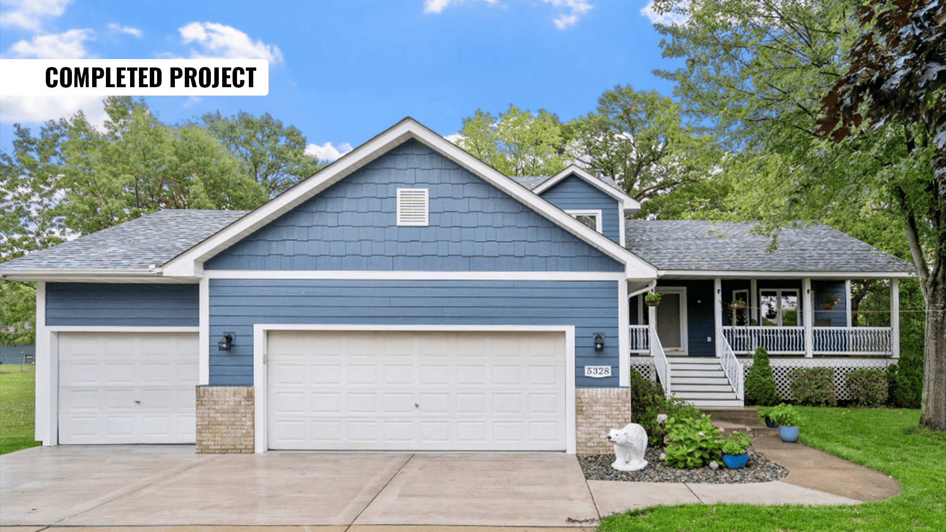 Blue house with porch and garage