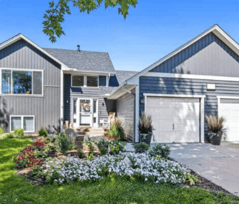 Gray house with garden and driveway