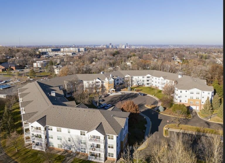 Aerial view of U-shaped residential complex.