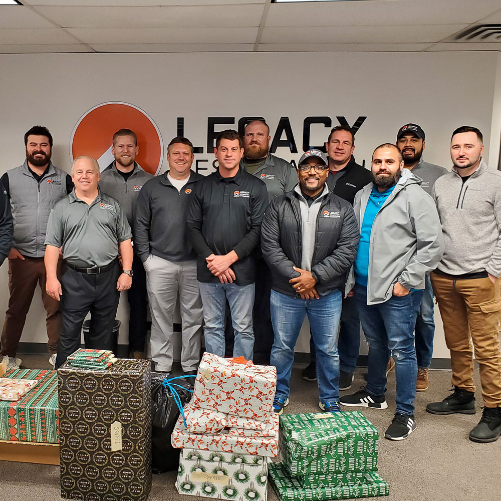 Legacy Restoration team with holiday gift donations