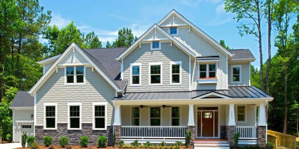 Two-story gray suburban house with front porch
