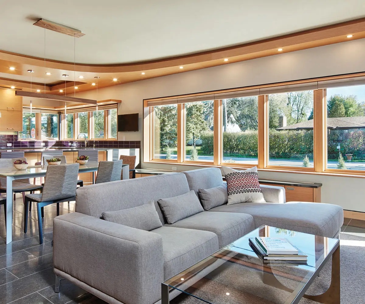 Bright open-concept living room, dining area, and kitchen