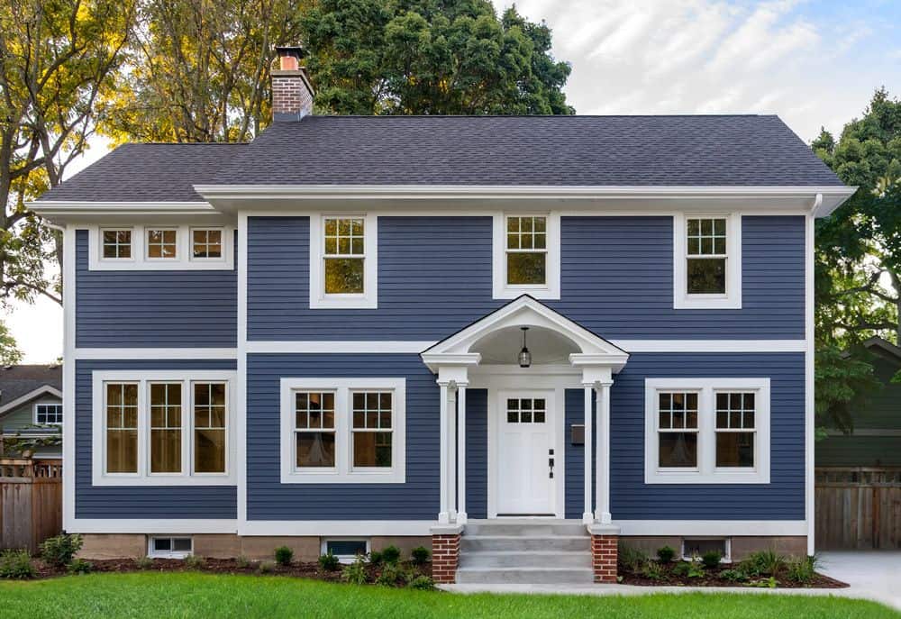 Blue two-story house with white trim and porch