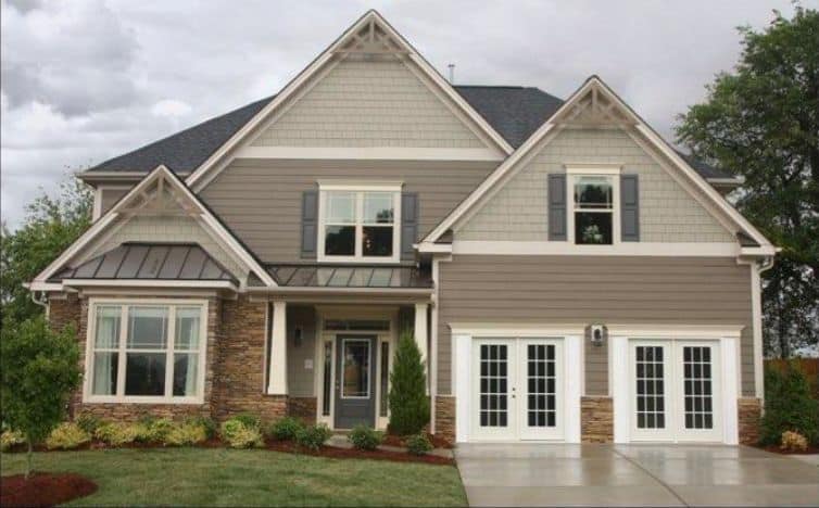 Two-story suburban home with gables and double garage