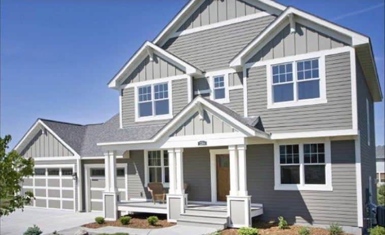 Gray two-story suburban house with white trim and garage